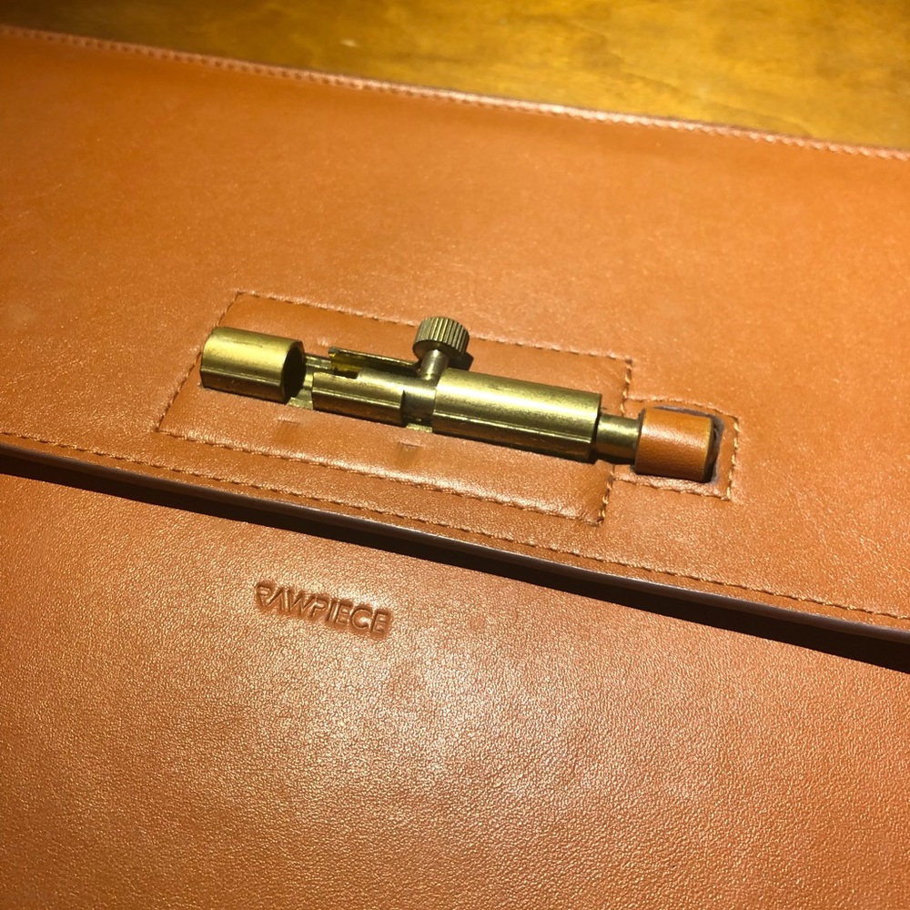 Rawpiece leather clutch